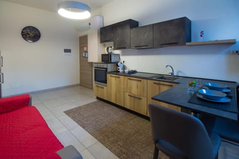 Kitchen or kitchenette, Living room, Seating area, Dining area, microwave, oven, stove