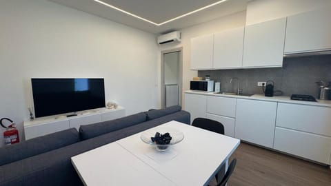 Kitchen or kitchenette, Living room, microwave, toaster, washing machine, air conditioner