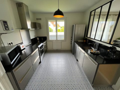 Kitchen or kitchenette, dishwasher, oven, stove, toaster