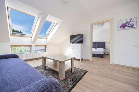 Bed, TV and multimedia, Living room, Seating area, Bedroom