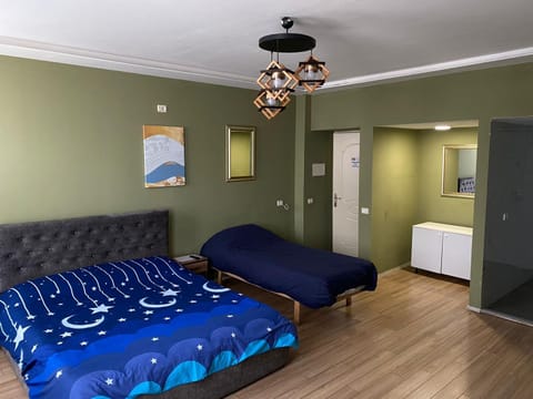 Bed, Living room, Seating area, Bedroom