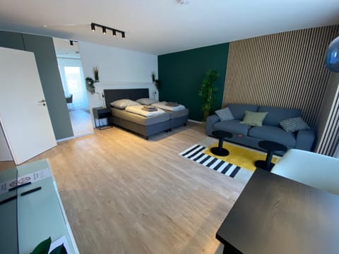 Bed, TV and multimedia, Living room, Seating area, Bedroom