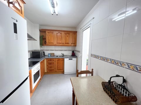 Kitchen or kitchenette, dishwasher, microwave, oven, stove, washing machine