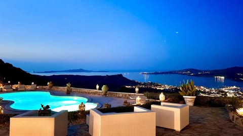 Property building, Patio, Nearby landmark, Night, Natural landscape, Seating area, Mountain view, Pool view, Sea view, Swimming pool, Breakfast, sunbed