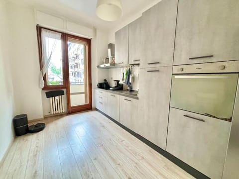 Kitchen or kitchenette, dishwasher, oven, stove