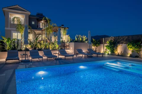Property building, Patio, Night, Pool view, Swimming pool, sunbed
