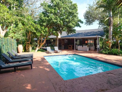 Property building, Patio, Garden, Garden view, Swimming pool, sunbed