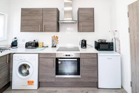 Kitchen or kitchenette, oven, stove, toaster