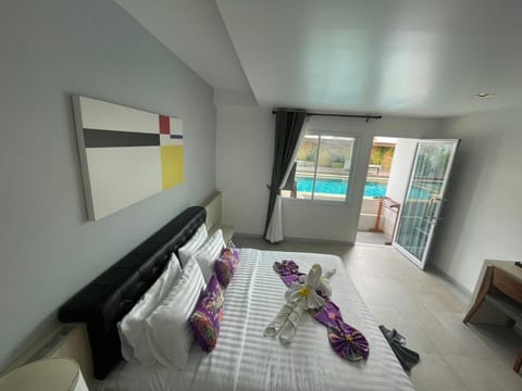 Bed, Photo of the whole room, Bedroom, Pool view, sunbed, towels