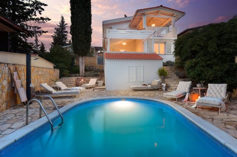 Property building, Patio, Night, Natural landscape, Pool view, Swimming pool, sunbed