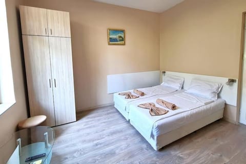 Bed, towels, wardrobe