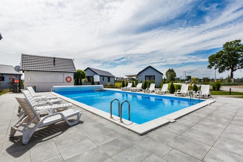 Property building, Day, Pool view, Swimming pool, sunbed