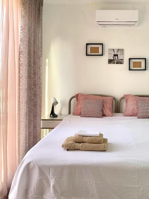 Bed, Photo of the whole room, Bedroom, towels, air conditioner