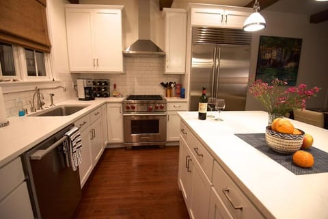 Kitchen or kitchenette, dishwasher, oven, stove