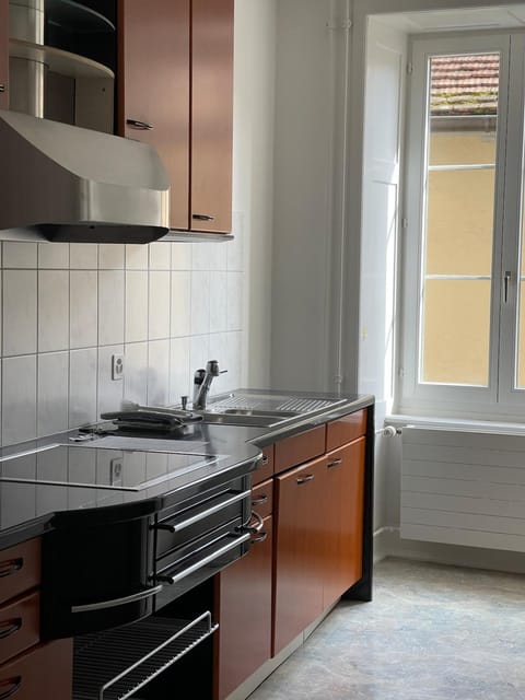 Kitchen or kitchenette, microwave, oven, stove