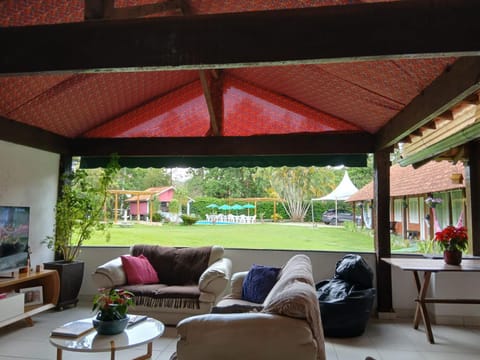 Communal lounge/ TV room, Living room, Seating area, Garden view, Pool view