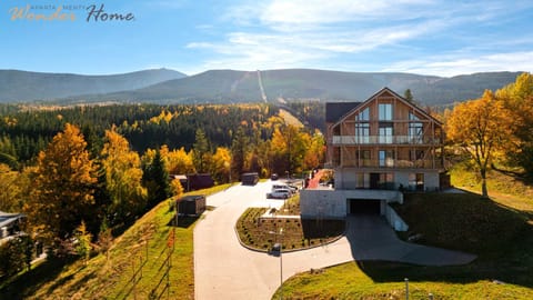 Property building, Nearby landmark, Day, Neighbourhood, Natural landscape, Mountain view, Parking