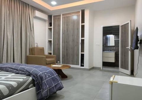 Bed, TV and multimedia, Living room, Seating area, Bedroom, wardrobe