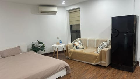 Bed, TV and multimedia, Living room, Seating area, Bedroom, wardrobe, air conditioner