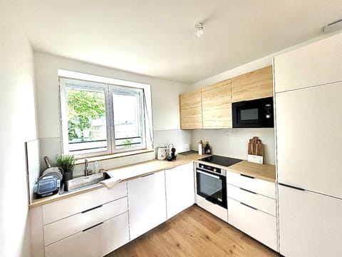 Kitchen or kitchenette, dishwasher, oven, stove