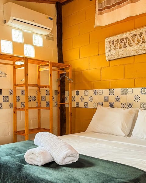 Bed, towels, air conditioner