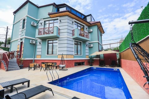 Property building, Pool view, Swimming pool, sunbed