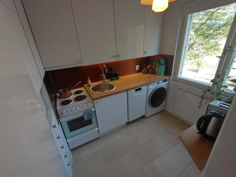 Kitchen or kitchenette, dishwasher, oven, stove, washing machine, dryer