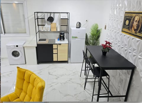 Kitchen or kitchenette, washing machine