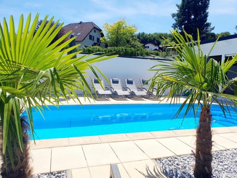 Property building, Living room, Swimming pool