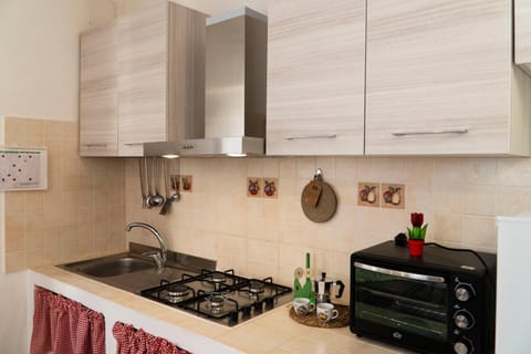 Kitchen or kitchenette, microwave, stove