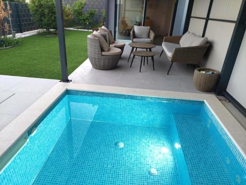 Patio, Hot Tub, Seating area, Swimming pool, sunbed