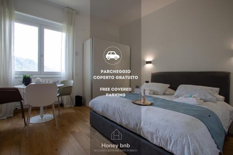Bed, Photo of the whole room, Bedroom, Text overlay, towels