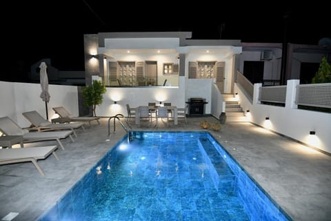 Property building, Patio, Night, Pool view, Swimming pool, sunbed