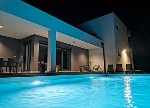 Patio, Night, Pool view, Swimming pool, sunbed