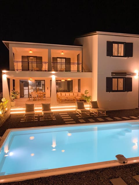 Property building, Night, Pool view, Swimming pool, sunbed