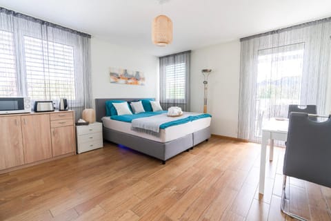 Bed, Photo of the whole room, microwave, toaster