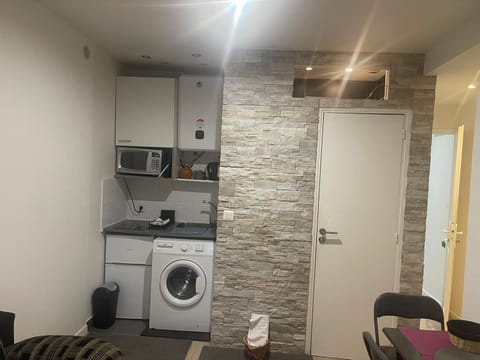 Kitchen or kitchenette, washing machine