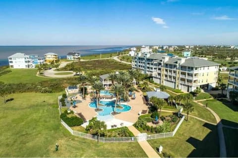 Rise and Shine Beach House with Ocean Views and Pointe West Resort Pools House in Galveston Island