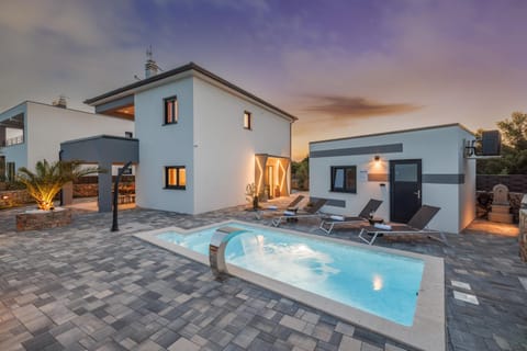Property building, Patio, Natural landscape, Pool view, sunbed