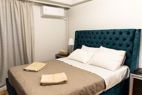Bed, Photo of the whole room, Bedroom, towels, air conditioner