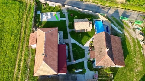 Property building, Natural landscape, Bird's eye view, Pool view, Street view, Swimming pool
