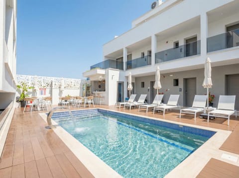 Property building, Day, View (from property/room), Pool view, Swimming pool, sunbed