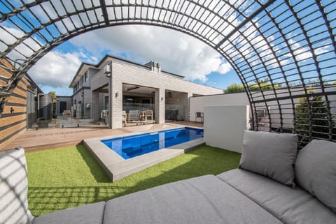 Property building, Seating area, Swimming pool, sunbed