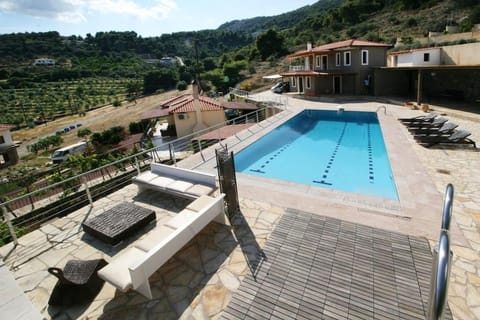 Property building, Patio, Natural landscape, Pool view, Swimming pool