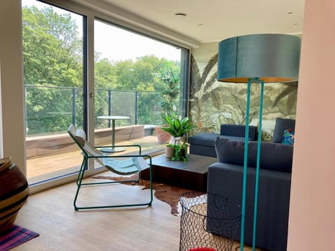 View (from property/room), Balcony/Terrace, Living room, Seating area, Garden view