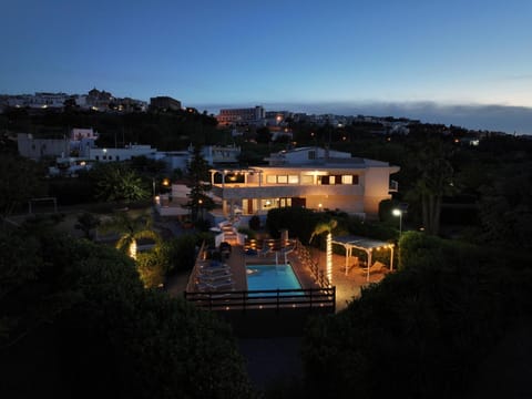 Property building, Night, Natural landscape, Pool view, Sea view, Swimming pool, sunbed