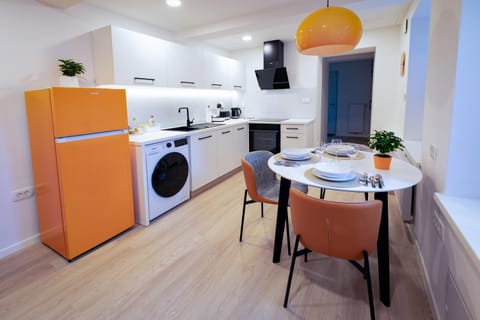 Living room, Dining area, dishwasher, oven, stove, washing machine, dryer, kitchen