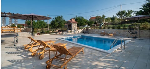 Patio, Day, Natural landscape, Pool view, sunbed