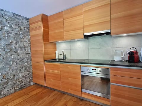 Kitchen or kitchenette, dishwasher, oven, stove, toaster