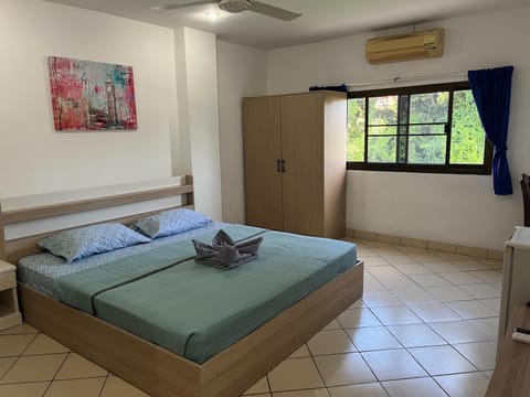 Bed, Photo of the whole room, Bedroom, towels, air conditioner